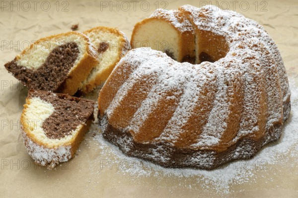 Traditional homemade marble cake. Sliced marble bundt cake on paper