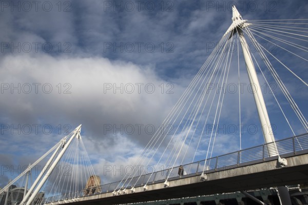 The famous historic Hungerford suspension Bridge crossing the river Thames in London city, United Kingdom