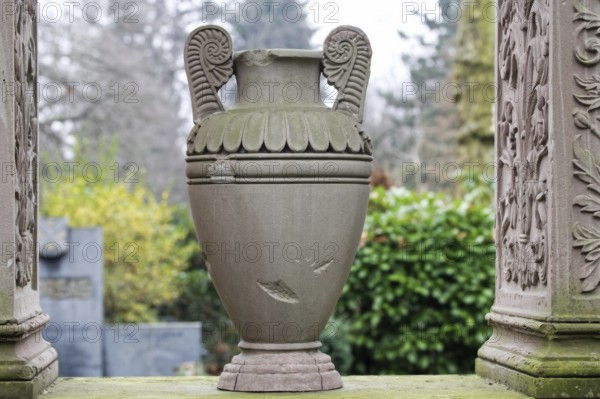 Amphora as a grave decoration on a gravestone at the Melaten cemetery in Cologne