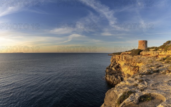 Cala Pi, Spain, 28 January, 2024: view of the historic Cala Pi watchtower in southern Mallorca at sunrise