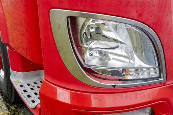 Headlight of a red truck