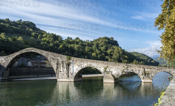 The Devils bridge or Ponte della Maddalena above Serchio river at Bongo a Mozzani town in Tuscany, Italy