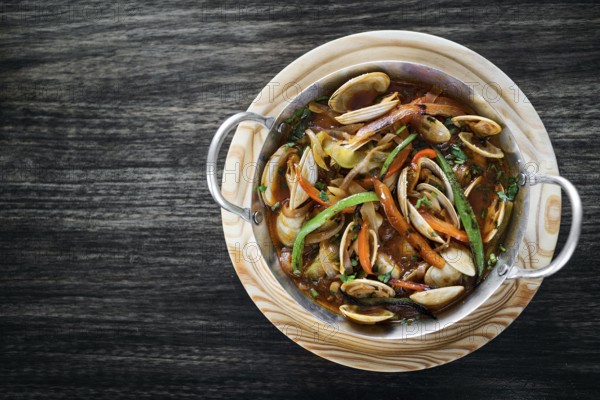 Gourmet portuguese clam and vegetable seafood stew in spicy tomato sauce