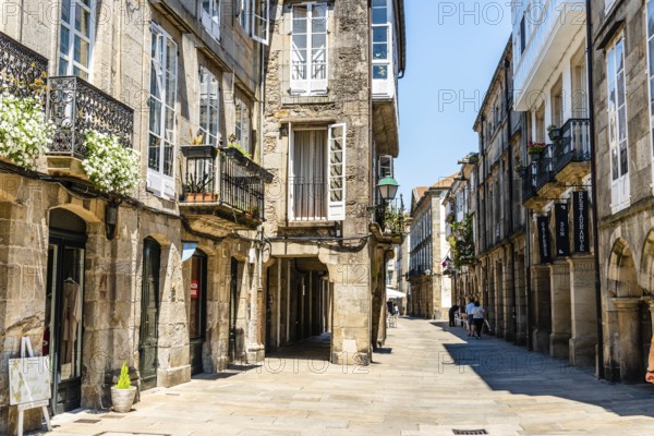 Santiago de Compostela, Spain, July 18, 2020: Old street with arcades in medieval town
