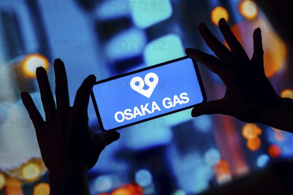 In this photo illustration, the Osaka Gas logo is seen displayed on a smartphone
