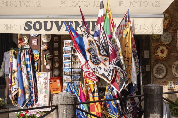 SIENA, ITALY, SEPTEMBER 23, 2023, A typical souvenir shop in downtown Siena, selling the typical city district flags
