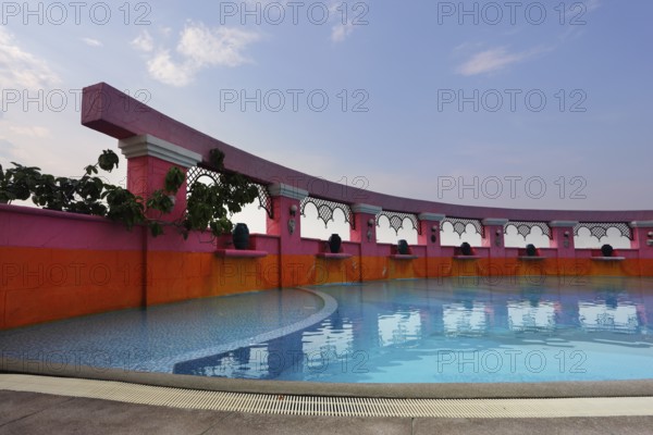 Beautiful pool in magnificent hotel of Bangkok. A sunset