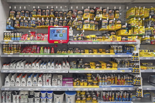 Shelves with adhesives, DIY store, Bavaria, Germany