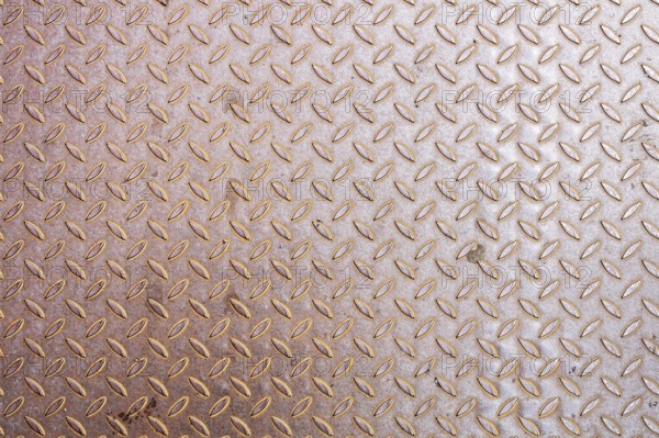 An image of a rusty diamond metal plate background