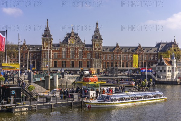 The city of Amsterdam in springtime with houses and water is a famous travel location