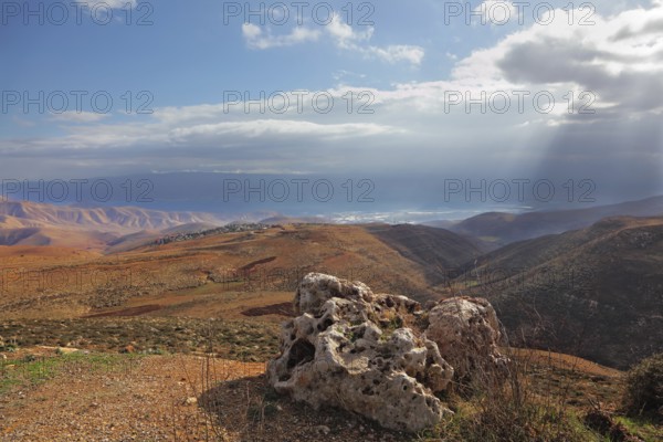 Magnificent transparent day in Judean desert. Easy shades from clouds on soft hills