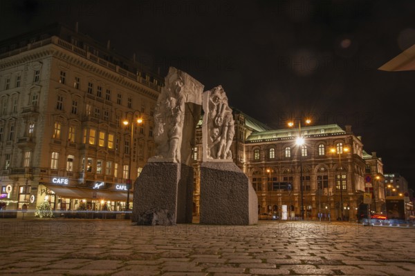 Memorial against war and fascism, monument by Alfred Hrdlicka, behind the opera, night shot, Vienna, Austria
