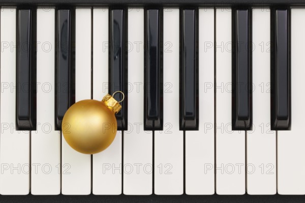 Top view close up shot of piano keyboard and Christmas decoration. Flat Lay Image