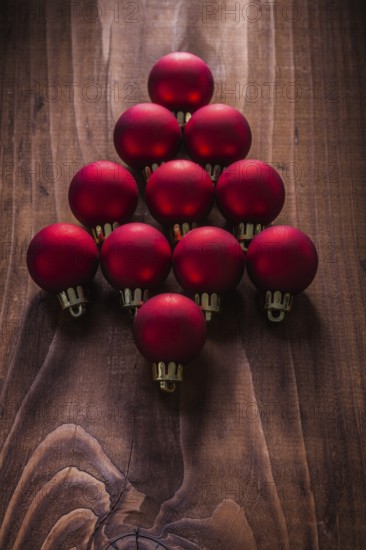 Composition red christmas balls in the form simbold of fir tree