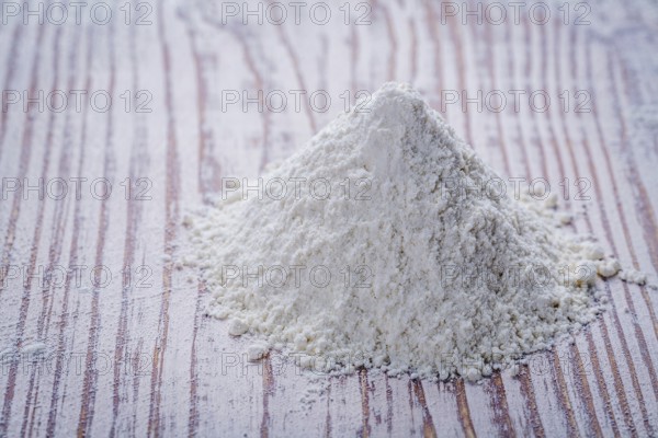 White flour on wooden board food and drink concept
