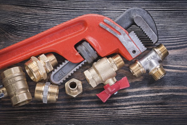 Set of plumbing tools on wooden board horizontal view