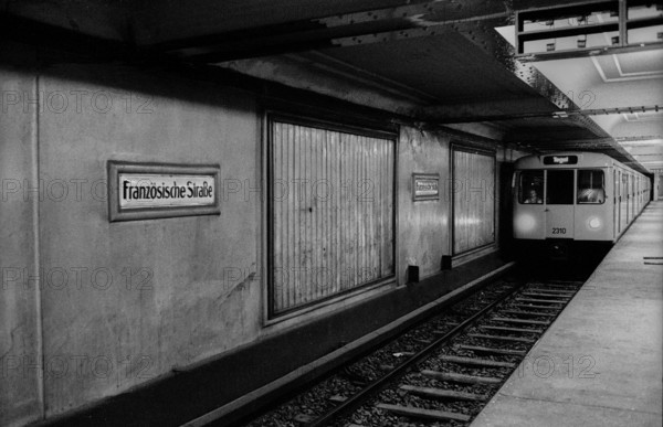 GDR, Berlin, 29.5.1990, U-Bahn station Französische Straße (U 6), 28 years ghost station..., station sign, S-Bahn train