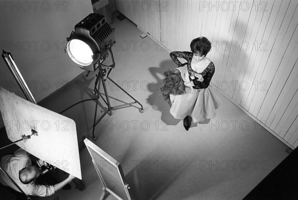 1960s photographer and model. The actress and singer Lill Lindfors posing in a spanish outfit in a photographers studio. December 1965