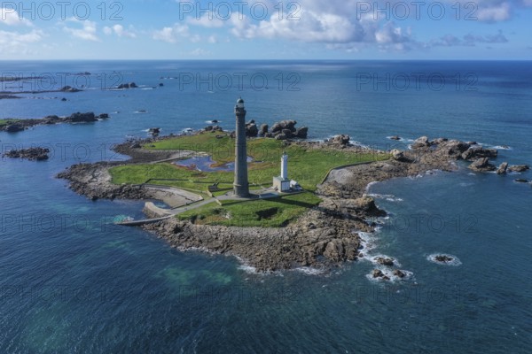 Aerial view island Ile Vierge with lighthouses Phare de l'Ile Vierge, old lighthouse from 1845 and new lighthouse from 1902, with 82, 5 metres highest lighthouse in Europe, off the coast of Plouguerneau, department Finistere Penn-ar-Bed, region Bretagne Breizh, France