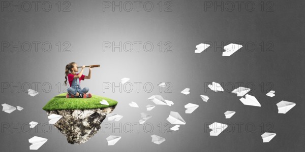 Cute kid girl sitting on floating island against concrete background