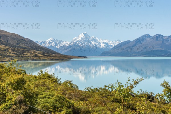 Scenic reflection of Mount Sefton and Mount Cook at lake Pukaki, South Island of New Zealand