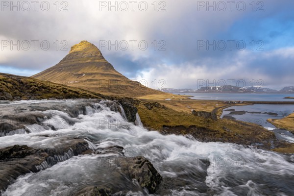 The Kirkjufell mountain and the kirkjufellfoss waterfall at grundarfjordur at Snæfellsnes peninsula in Iceland