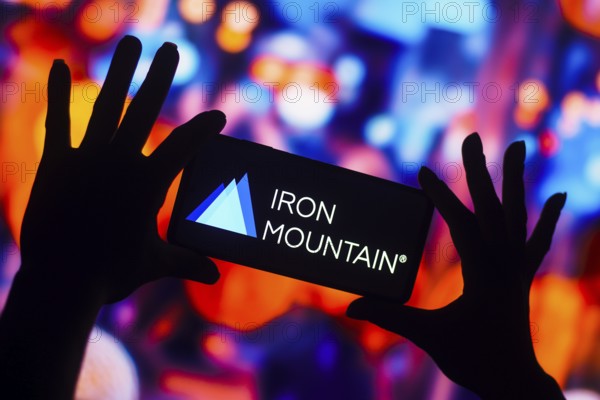In this photo illustration, the Iron Mountain Incorporated logo is displayed on a smartphone mobile screen