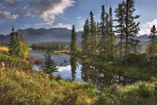 Silent lake in the early autumn morning in mountains