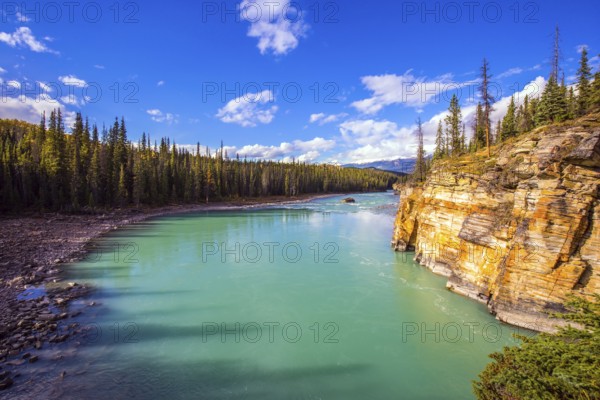 Athabasca River in the Rocky Mountains of Canada. Magnificent landscape in Jasper Park. Indian summer. Travel and photo tourism concept