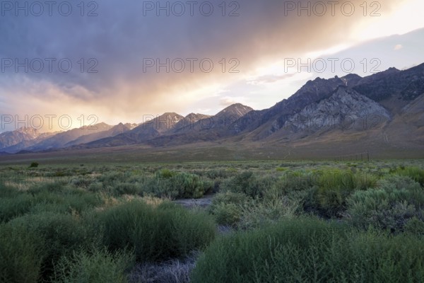 Mountain range with clouded colorful sunset, Eastern Sierra Nevada Mountains, Mono County, California, USA