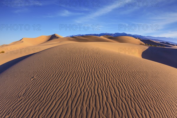 Bright sunny morning in a picturesque part of Death Valley. Thin waves on the sand. Mesquite Flat Sand Dunes