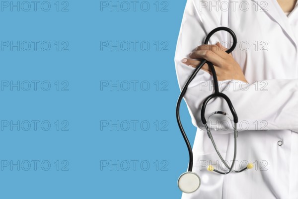Lady doctor with arms folded and a stethoscope around her neck