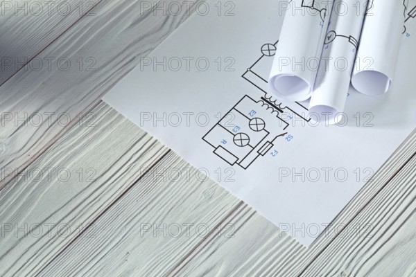 Electrical blueprints on vintage white wood