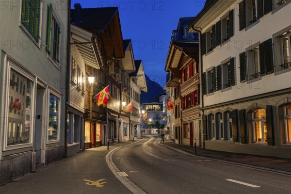 Night street view with traditional buildings and distant mountains, city, vilage, cityscapes, streets, old architecture, old buildings, Interlaken, Switzerland