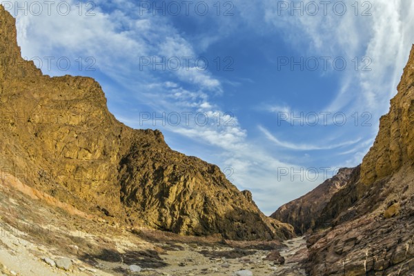 Picturesque and multi-color Black canyon in ancient Eilat mountains. Israeli warm winter. Photo taken fisheye lens