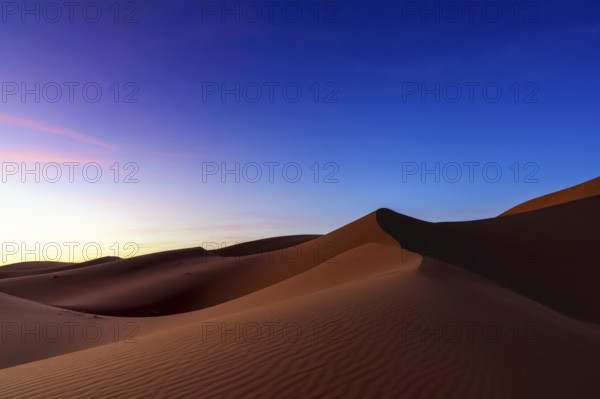 A view of the sand dunes at Erg Chebbi in Morocco at sunset