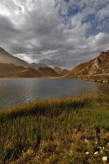 Autumn clouds over mountain lake