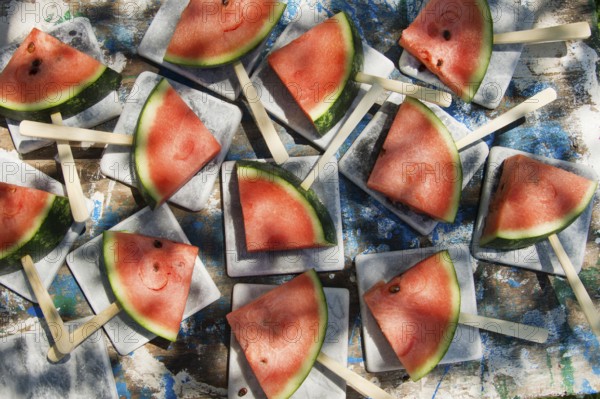 Presentation of a summer dish made up of slice of watermelon