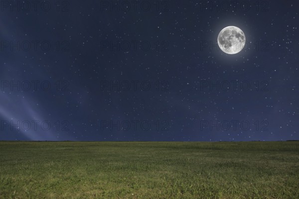 Night sky meadow background with moon and stars. Full moon