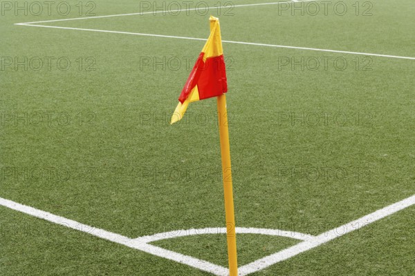 Corner of a ball soccer field wwith pile and flag