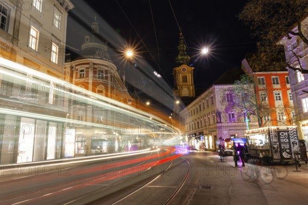 Light traces of a tram in Herrengasse, night shot, Graz, Styria, Austria