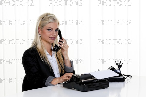 Young woman on the phone in the office. Austria