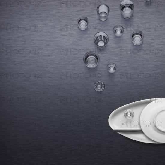 Creative dishware concept, figure of a fish blowing bubbles made of plates and glasses