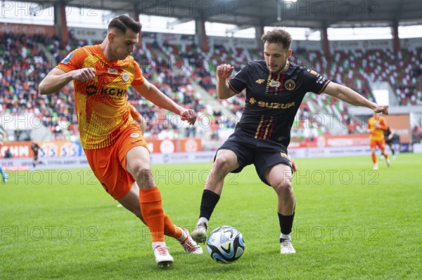 LUBIN, POLAND - MARCH 3, 2024: Football match Polish PKO Ekstraklasa between KGHM Zaglebie Lubin vs Korona Kielce 1:0. In action Bartosz Kopacz (L) Dalibor Takac (R)