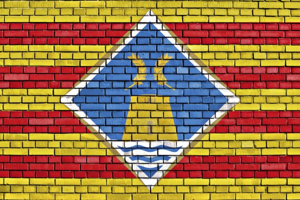 Flag of Formentera painted on brick wall