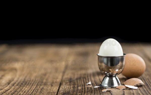 Wooden table with boiled Eggs (selective focus, close-up shot)