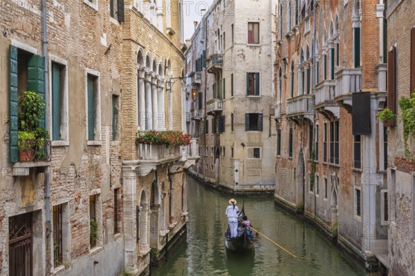Venice Italy, city skyline at canal in Venice with Gondola boat