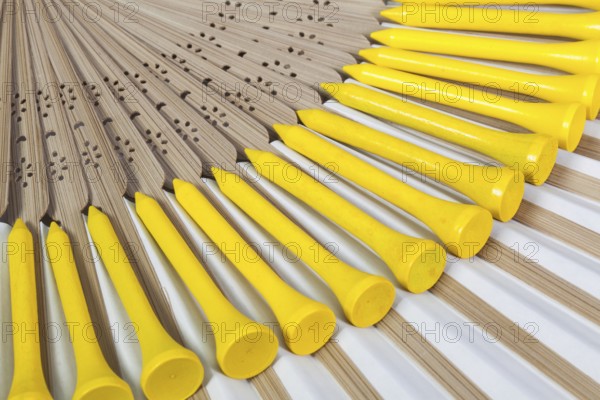 Typical Japanese hand fan made of bamboo and golf equipments