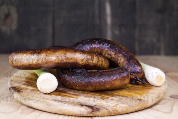 Fried Sausages On a Wooden Board