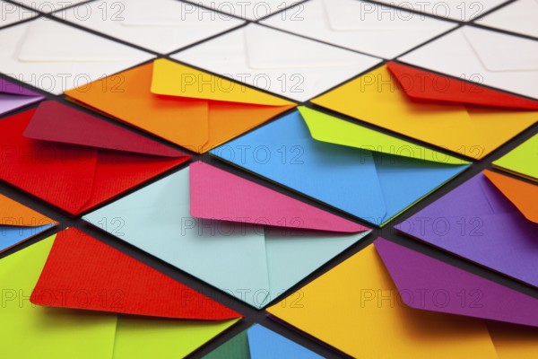 Composition with white and colored envelopes on the table. The photo suitable for various holidays and anniversaries